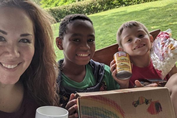 Woman and children with canned goods.